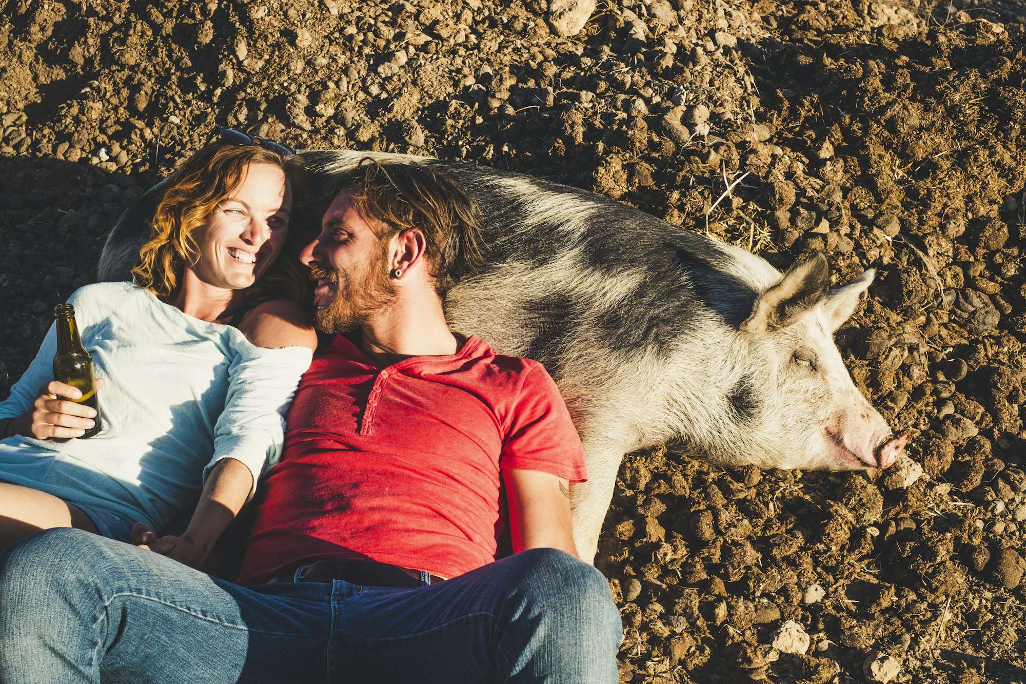 Diversity animal love pet therapy concept with young beautiful couple of young peope lay down